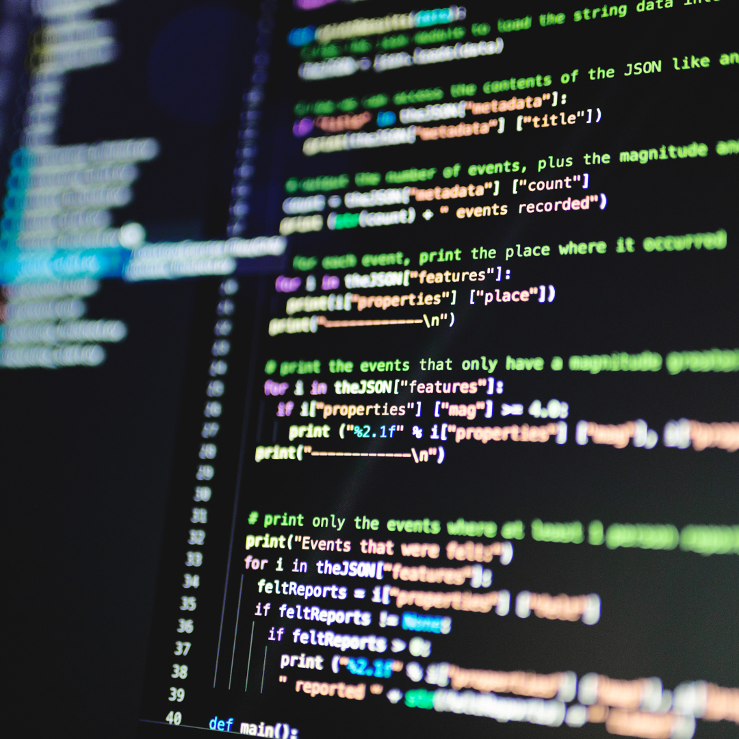Close-up of computer code representing dark web monitoring and cyber threat detection