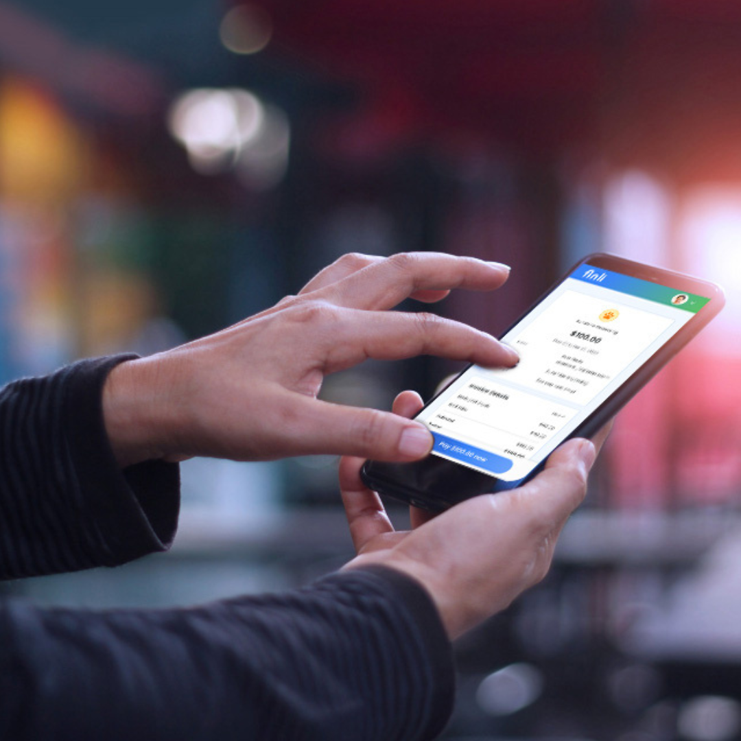 Person using a smartphone to make a digital payment, representing secure mobile payment solutions.