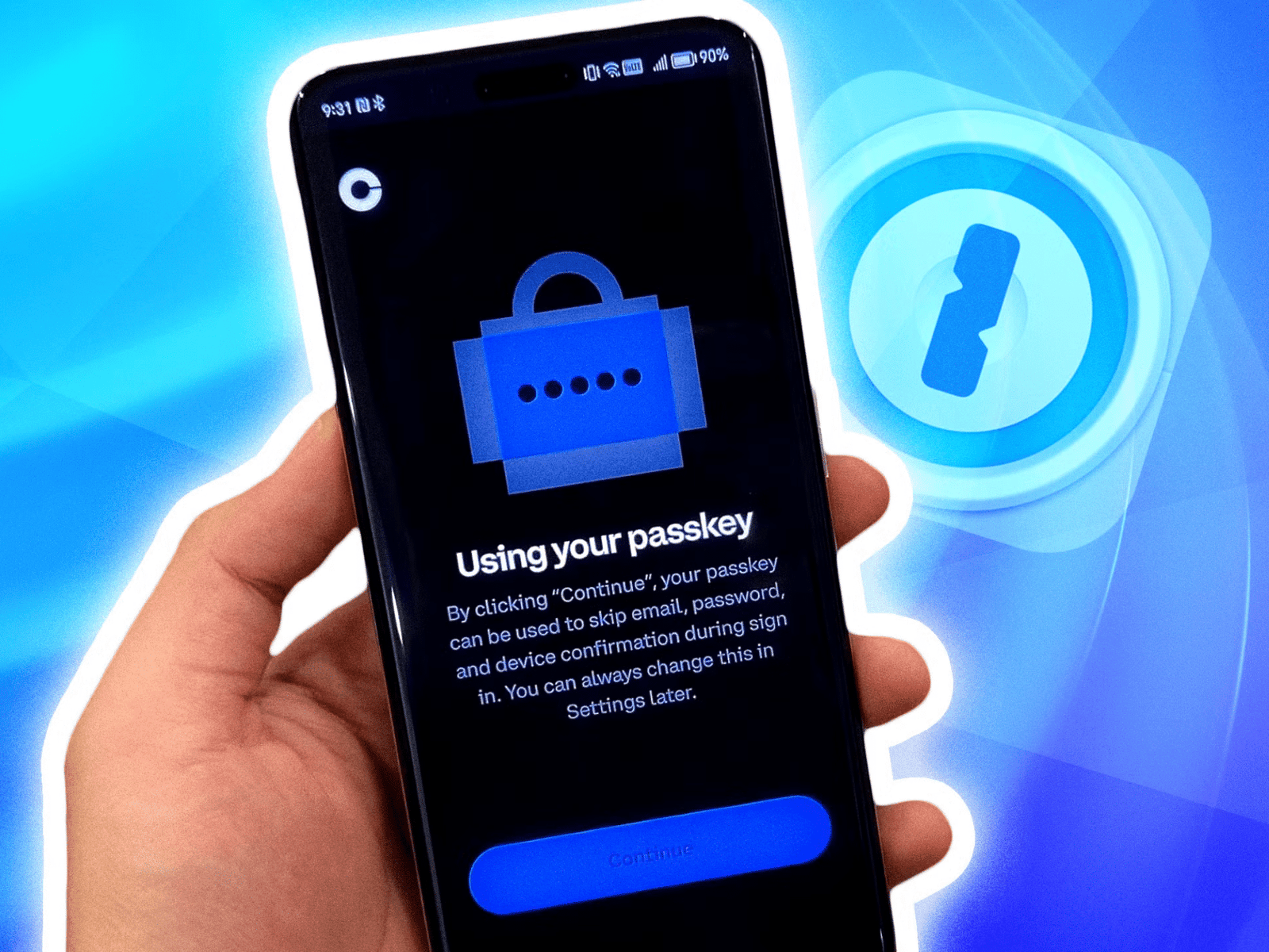 Hand holding a smartphone displaying a “Using your passkey” login screen
