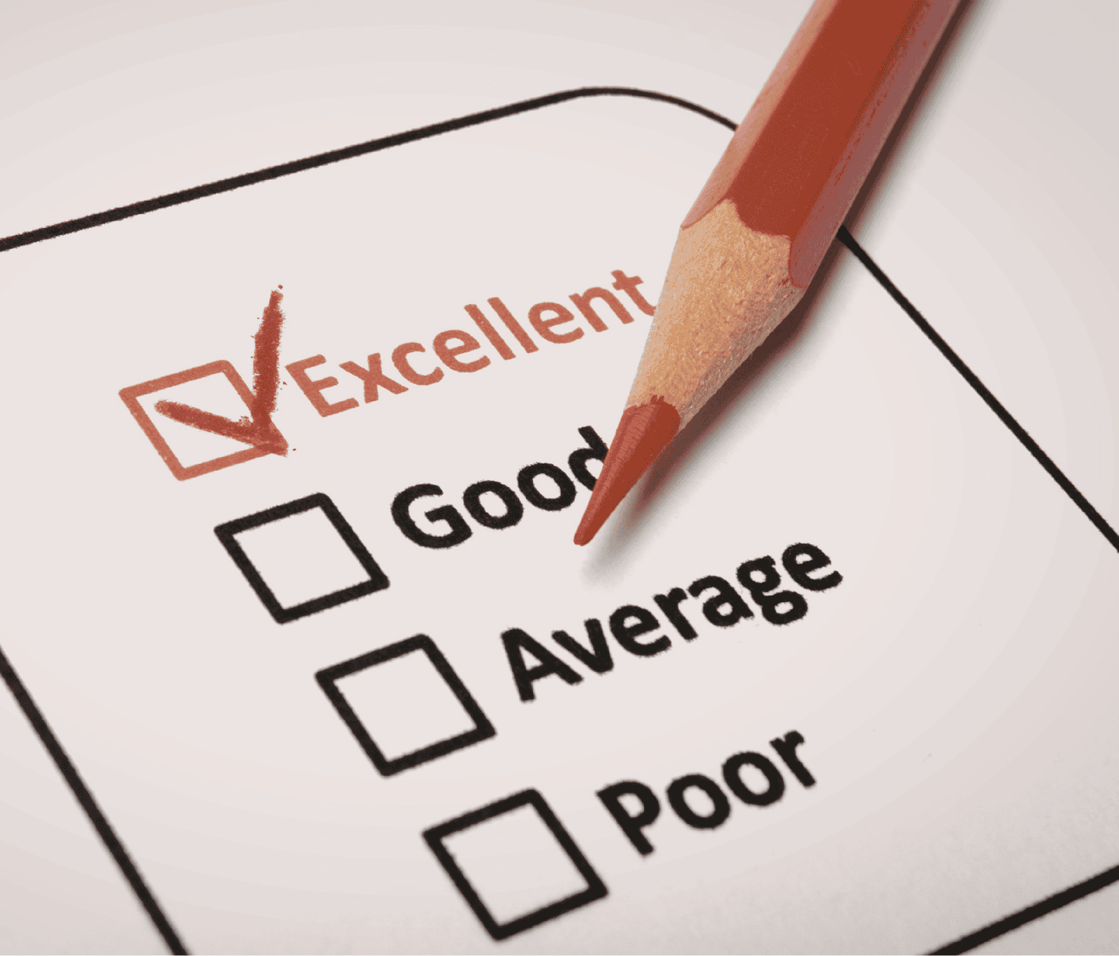 Close-up of a survey form with “Excellent” ticked, alongside options for good, average, and poor, with a pencil highlighting positive feedback.