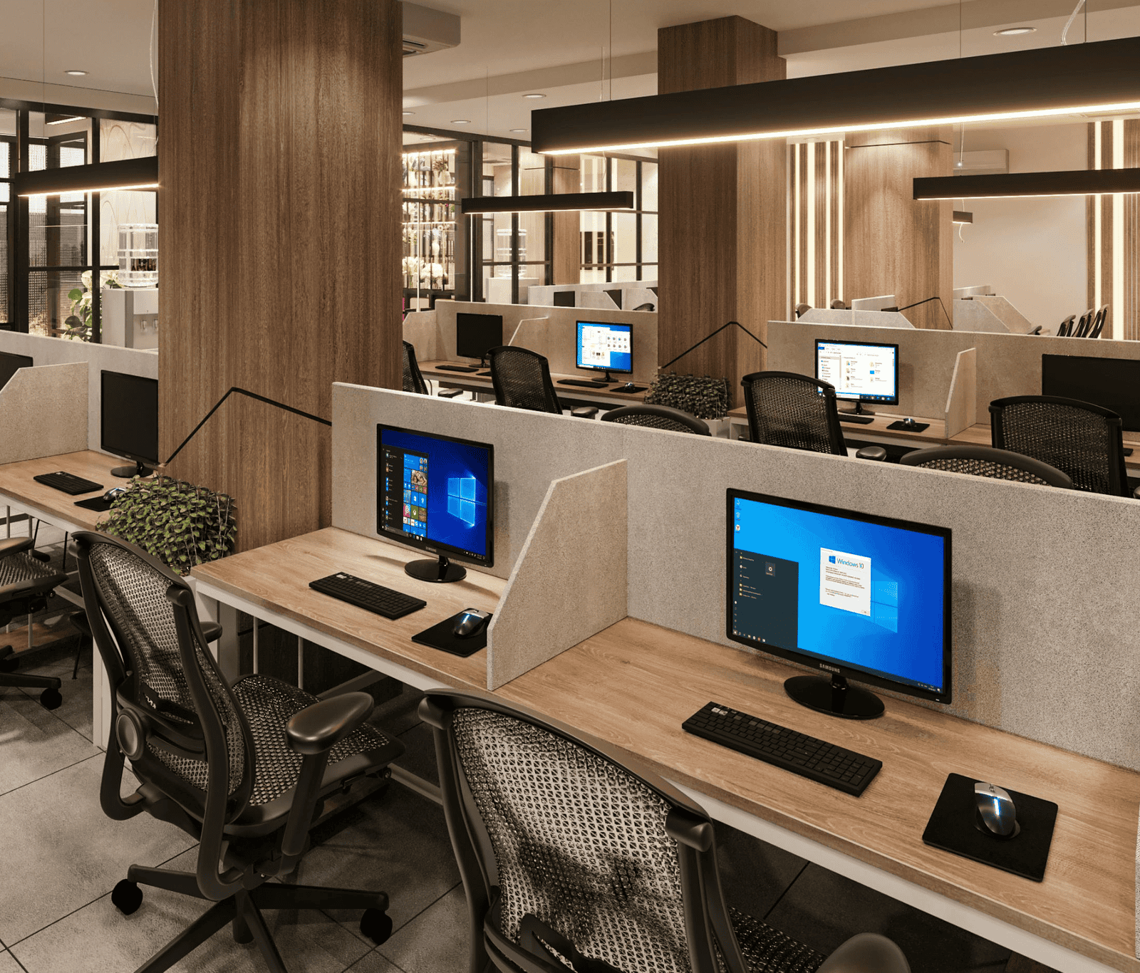 Modern office workspace with multiple connected desktops, illustrating reliable business WiFi supporting seamless connectivity across shared working environments.